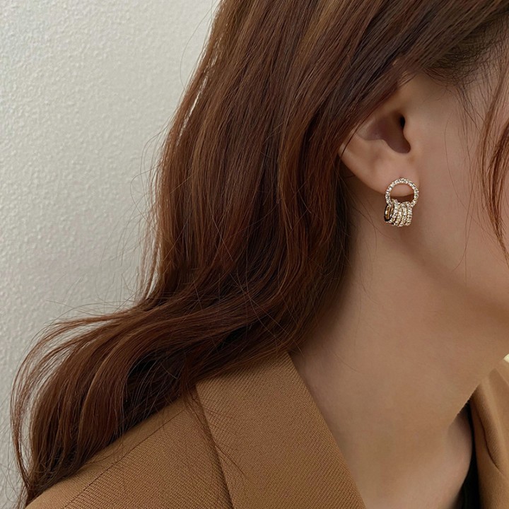 Rings of elegance: gold crystal-embellished earrings