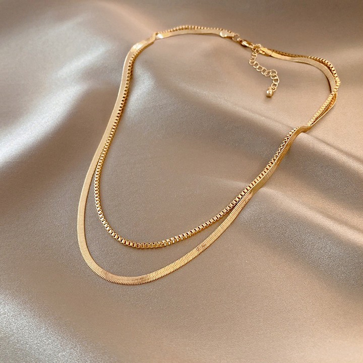 Double Golden Whispers: an elegant necklace with a modern twist